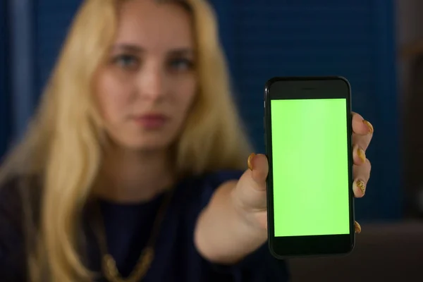 Cellphone screen in young womans hands