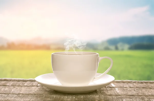 Late afternoon tea in a plain white cup