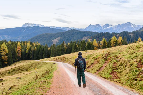 Mountaineer hiking in the alps, Austria. Autumn travel in mountains. Active lifestyle concept.