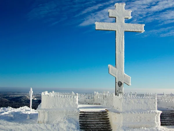 Cross near the temple in the winter