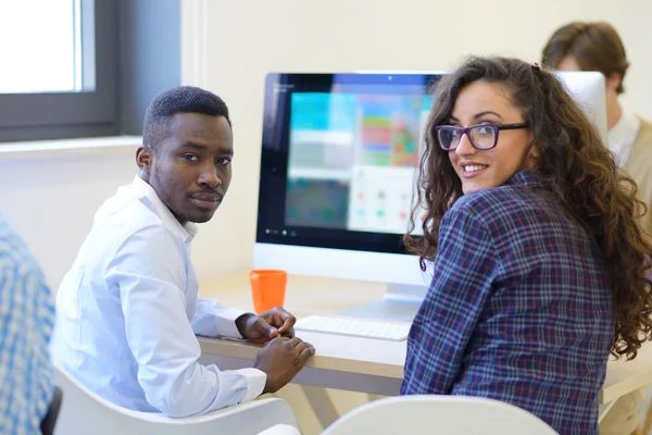 Happy business people working with laptop