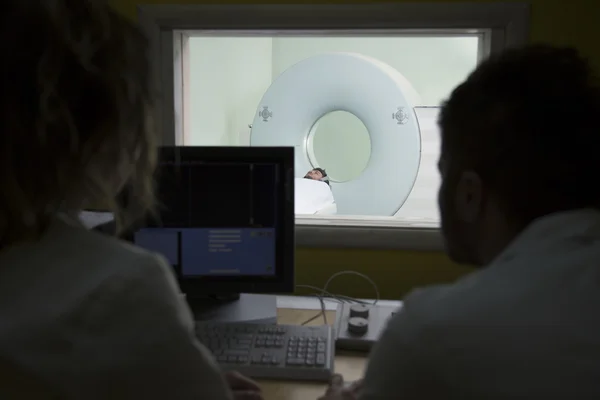 Scientist Scanning the brains of patients