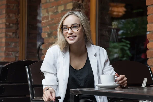 young woman in glasses