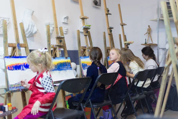 Girls at drawing lesson