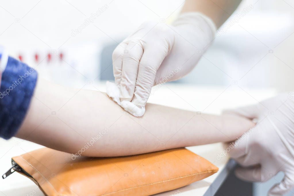 Disinfecting the arm skin
