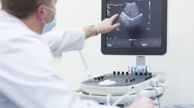 Doctor using Ultrasound machine clipart