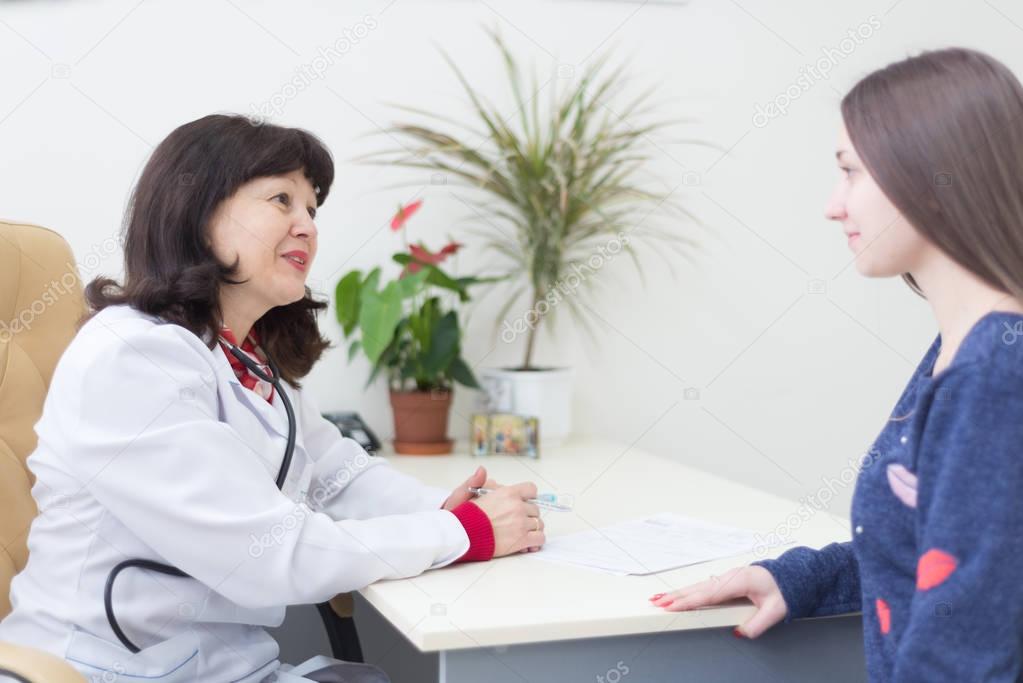 woman doctor with female patient