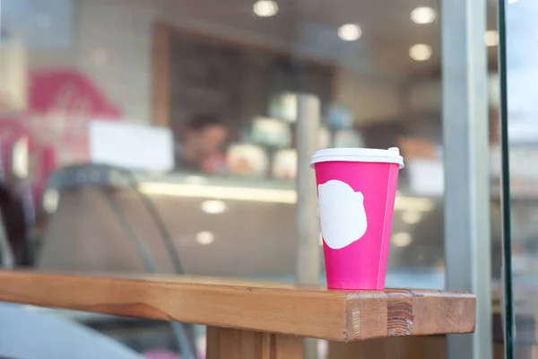 pink coffee cup in coffee shop