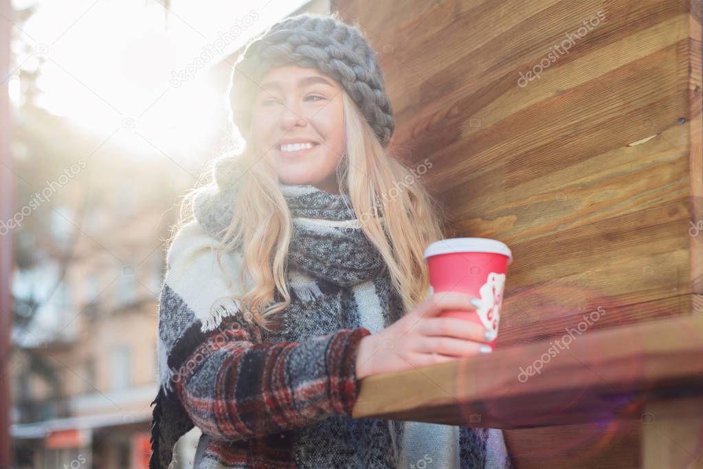 Girl with coffee cup outdoors