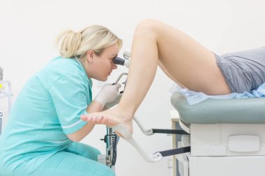 Female Gynecologist During Examination clipart