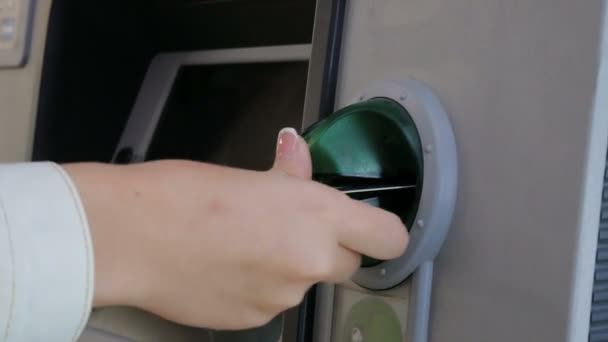 Insert the plastic card to the ATM. — Stock Video