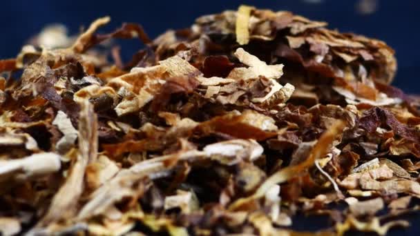 Pile of tobacco on a black background — Stock Video