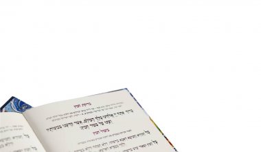 The Haggadah of Pesach Jewish text for Passover Evening. Isolated on White Background, Closeup - 