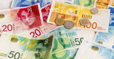 İsrail Yeni Şekeli banknot ve madeni paraların arka plan. Kavramsal görüntü