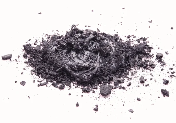 液态和固态黑色天然化妆品活化木炭或火山粘土 对白色背景有擦洗效果 图库照片