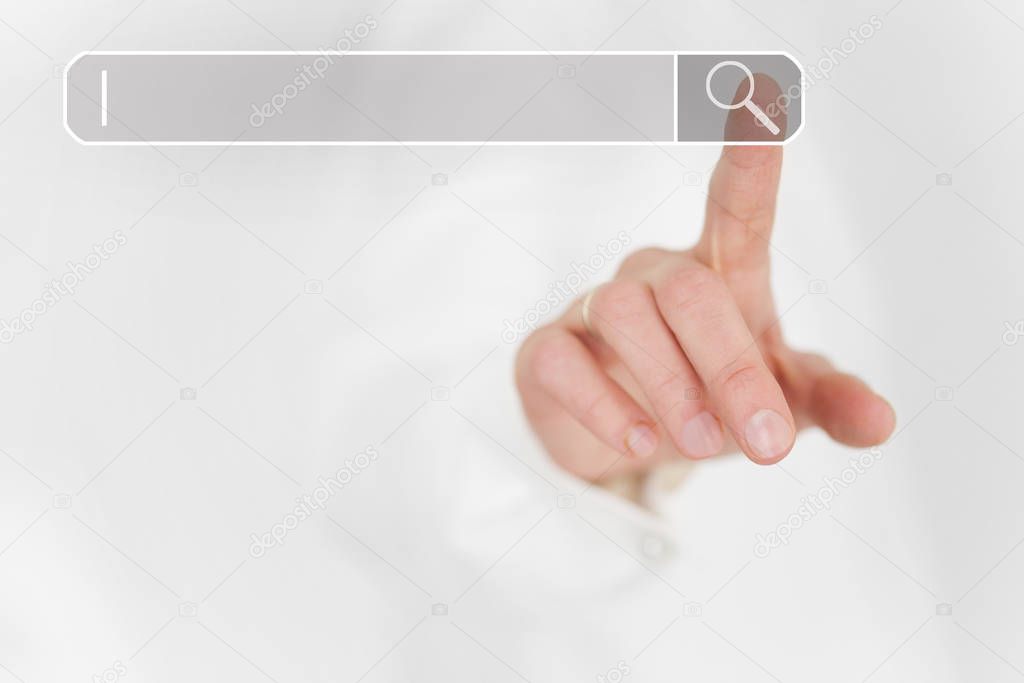 The index finger of a hand points to the search field