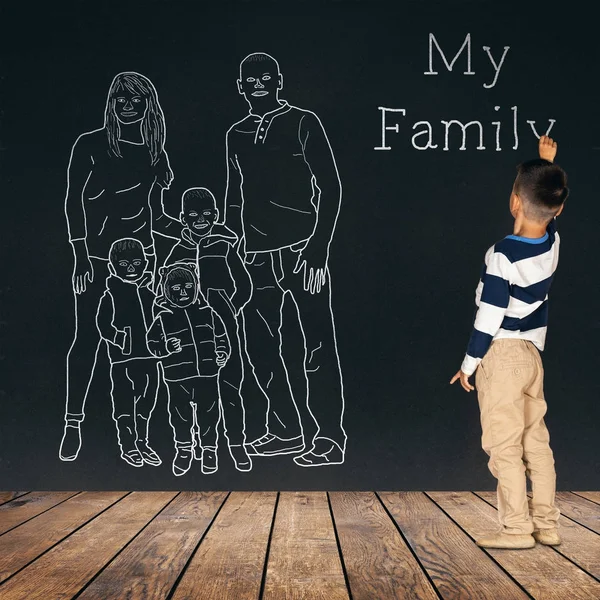 The child draws a family on the wall — Stock Photo, Image