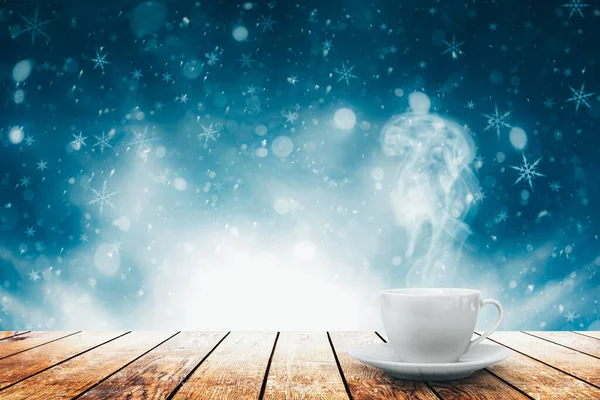 Hot coffee on the table on a winter background — Stock Photo, Image