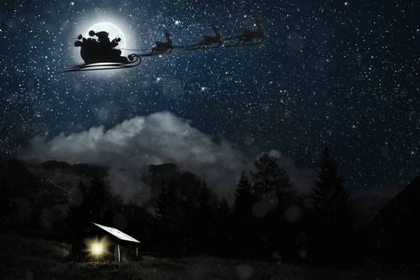 Bir uçan goth silüeti Noel Baba arka plan o karşı — Stok fotoğraf