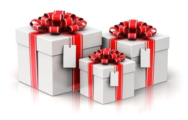 Three gift or present boxes with ribbon bows and label tags — Stock Photo, Image