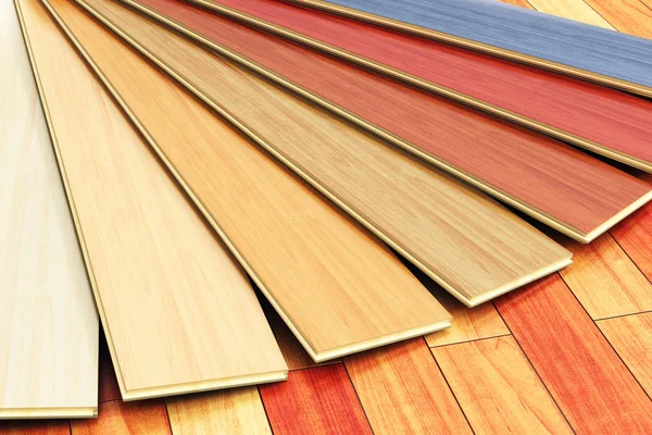 Wooden laminated construction planks assortment on parquet floor — Stock Photo, Image