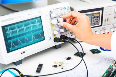 Oscilloscope is used by and electronic engineer in laboratory