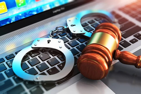 Handcuffs and judge mallet on laptop keyboard — Stock Photo, Image