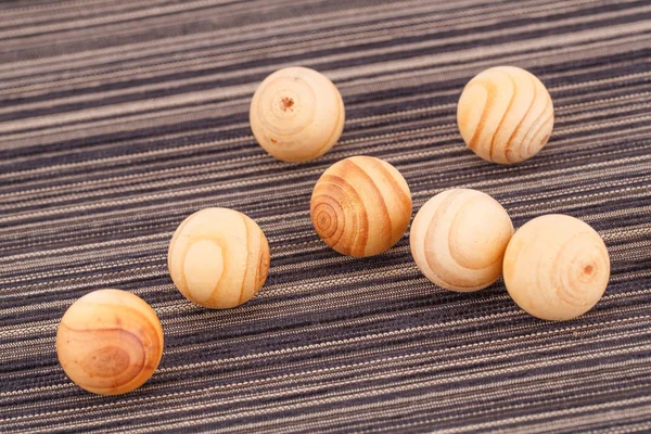 Wooden balls on cloth — Stock Photo, Image