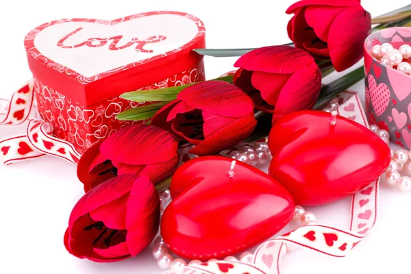 Red heart candles, tulips, necklaces and gift boxes Stock Photo