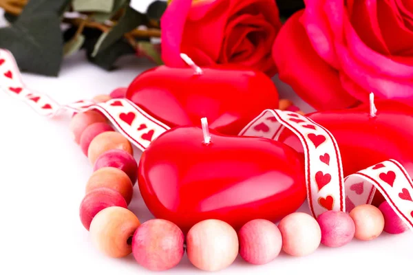 Red heart candles, necklace and roses — Stock Photo, Image