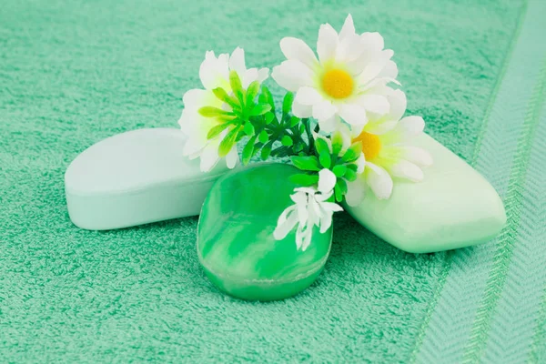 Colorful soaps and flowers — Stock Photo, Image