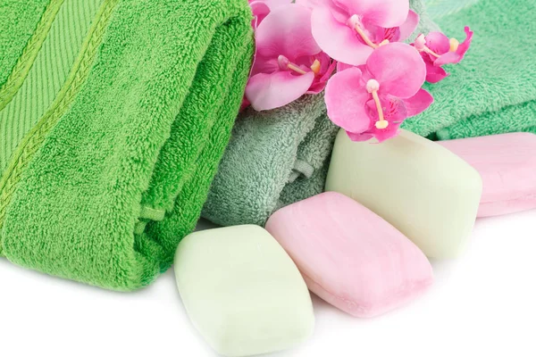 Towel, soaps and flowers — Stock Photo, Image