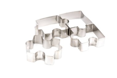 Beyaz arkaplanda izole edilmiş yapboz pişirme kalıpları.