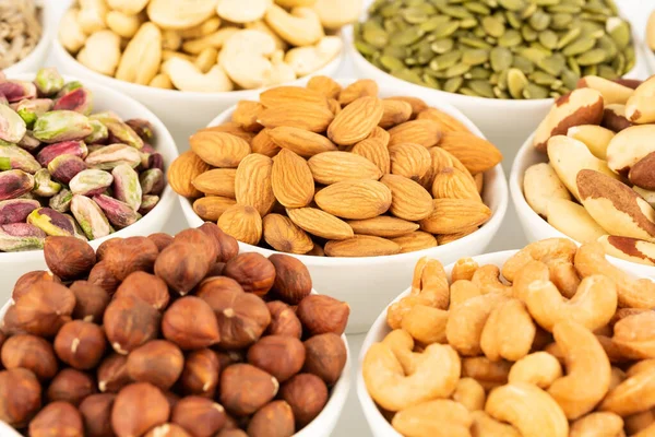 Various Kind Nuts Seeds White Ceramic Bowls — Stock Photo, Image