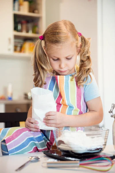 Cute little girl preparing Christmas sweets — Stock Photo, Image