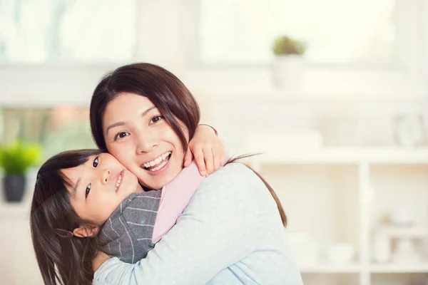 Portrait of happy japanese mother hugging with her cute little d — Stock Photo, Image