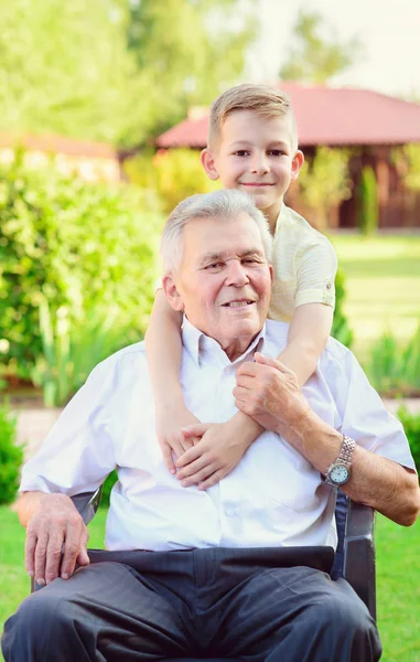 Portrait of happy old grandfather and cute children — Stock Photo, Image