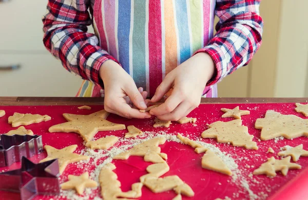 Close up of childs hands making christmas cookies Stock Photo