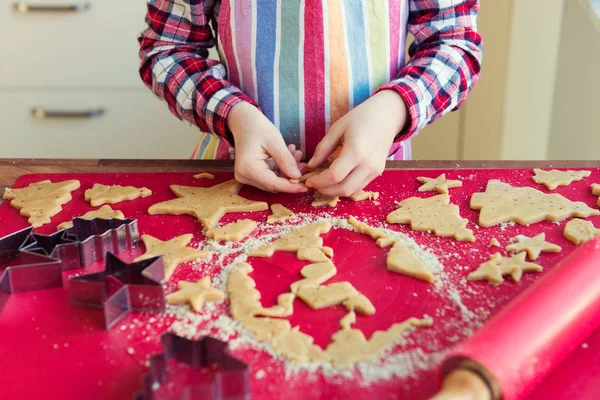 Close up of childs hands making christmas cookies Royalty Free Stock Photos