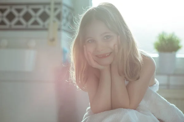 Portrait of pretty little child girl with white towel after show — Stock Photo, Image