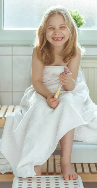 Portrait of pretty little child girl with white towel after show — Stock Photo, Image