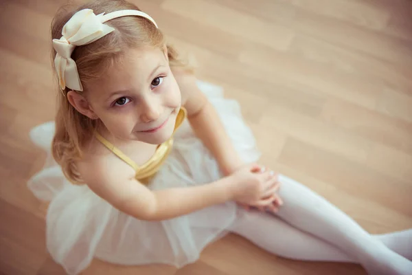 Cute Little Blonde Girl Sitting Ballet Tutu Bow Her Hair — Stock Photo, Image