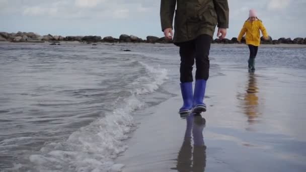 Two Children Walking Coast Baltic Sea Rubber Boots — Stock Video