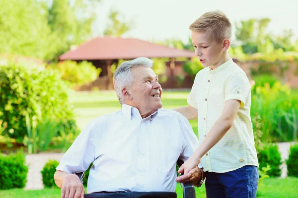 Teen Grandson Visiting His Old Grandfather Nurising Home — Stock Photo, Image