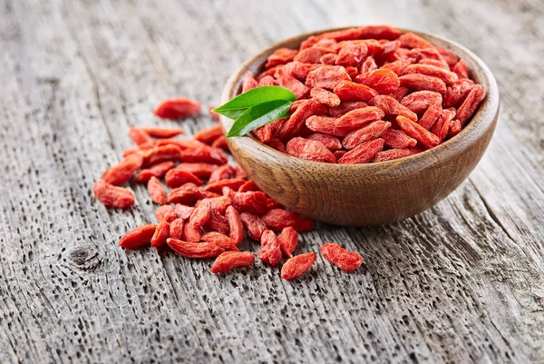 Goji berries on a wooden background — Stock Photo, Image