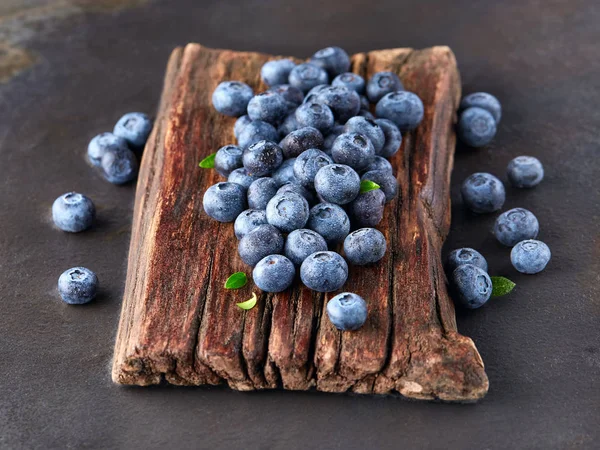 Blueberry on a wooden board — Stock Photo, Image