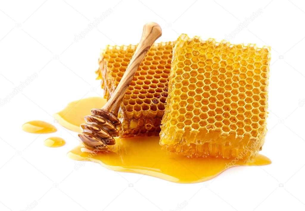 Honeycombs with wooden spoon