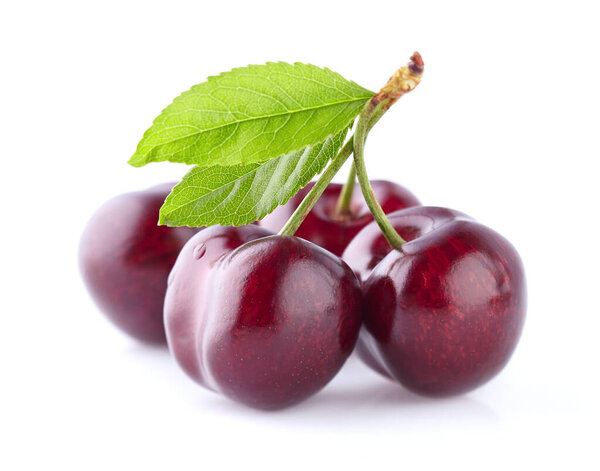 Cherries with leaves isolated on white background