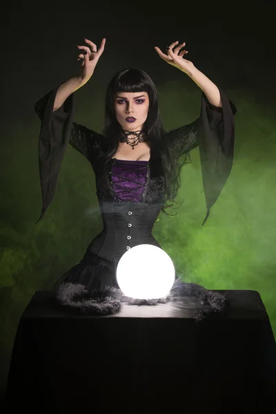 Beautiful fortune teller wearing gothic style — Stock Photo, Image
