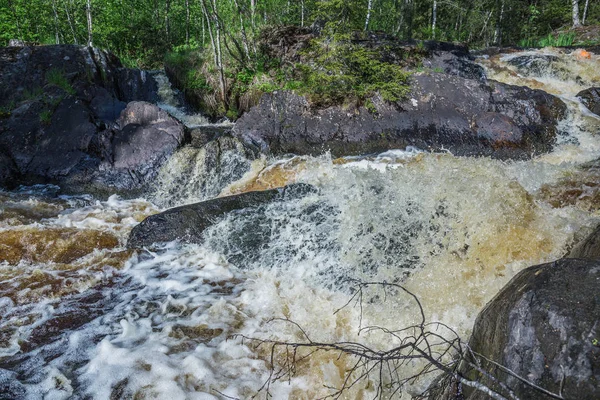 picturesque landscape with waterfall in forest of Karelia, Russia